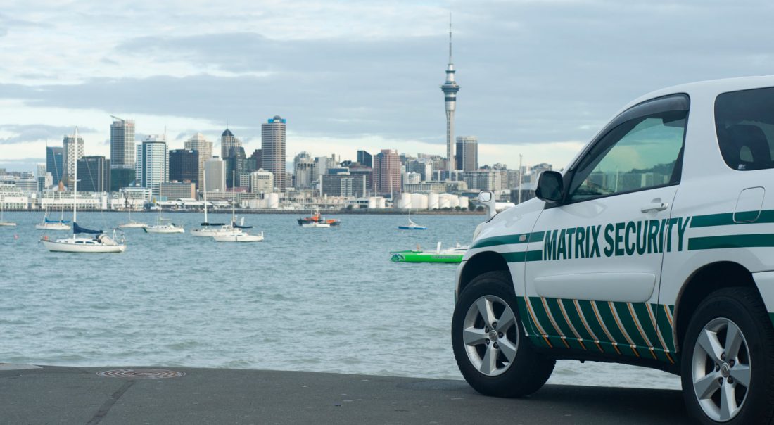 Photo of Matrix Security response vehicle with Auckland City in background